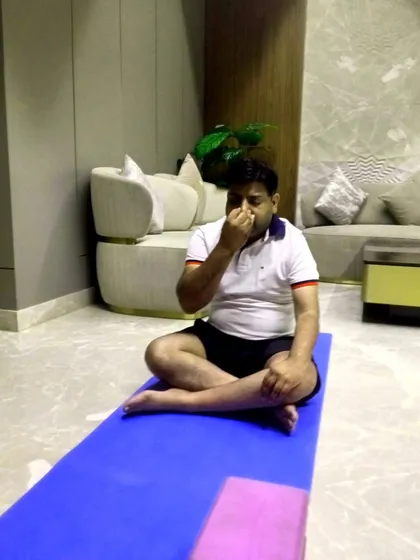 Teaching pranayama (breathing exercises) as part of a corporate wellness session. These techniques are very effective for stress management in a work environment.