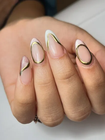 Dramatic and artistic. This design features bold, curved chrome lines over a cat-eye French base, creating a modern, sculptural effect on the nails.
