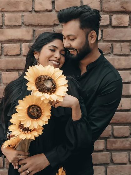A sweet and romantic moment with sunflowers. The makeup is natural and fresh, letting her happiness shine.