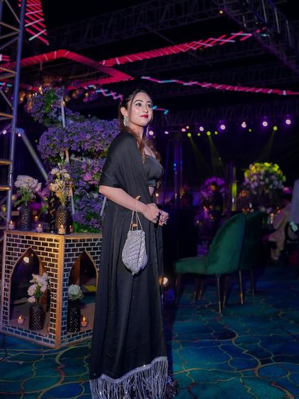 A full view of my black Sangeet outfit. The fringed cape added a fun element of movement as I walked the stage.