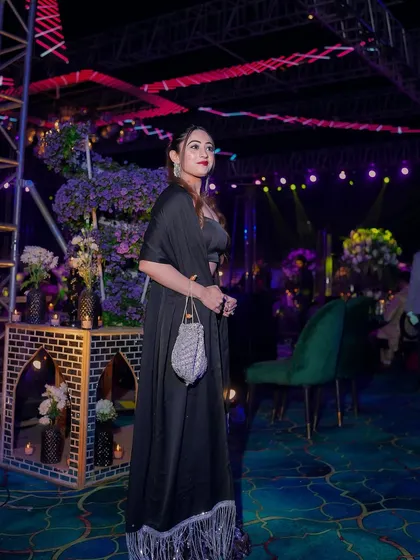 A full view of my black Sangeet outfit. The fringed cape added a fun element of movement as I walked the stage.