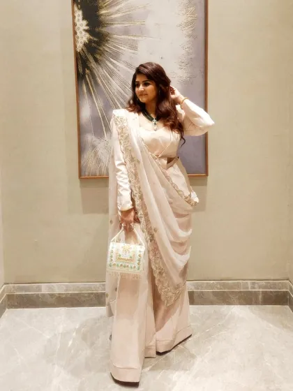 My approach to style is about expressing your authentic story. This powder peach powersuit, paired with a traditional zardozi dupatta, is a perfect example of fusion power dressing. It's not about following trends, but about creating a look that resonates with your personality and presence.