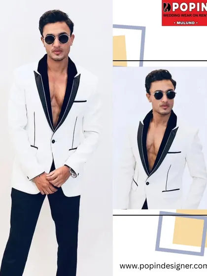 For that cocktail party or reception, a sharp tuxedo is a must. This white blazer with a contrasting black lapel is a modern, confident choice that I offer for men who want to make a statement.