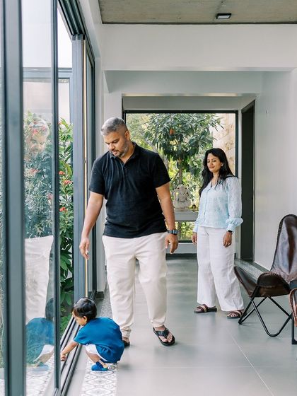 A family exploring their beautiful home. The large windows and open spaces provided a stunning backdrop for this lifestyle session.