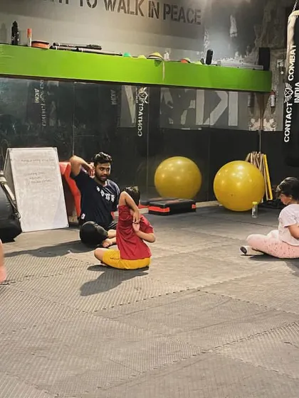 Our kids' program focuses on building discipline and body awareness through structured exercises and stretches.