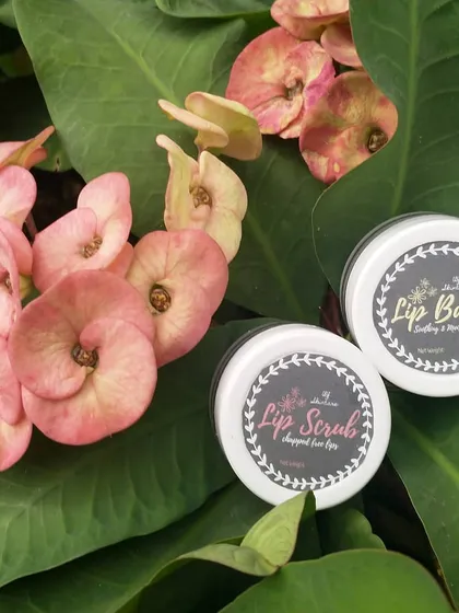 My lip care duo, the sugary lip scrub and soothing lip balm, nestled among nature. I make these with shea butter and almond oil to gently exfoliate and deeply moisturize, leaving your lips soft and healthy.
