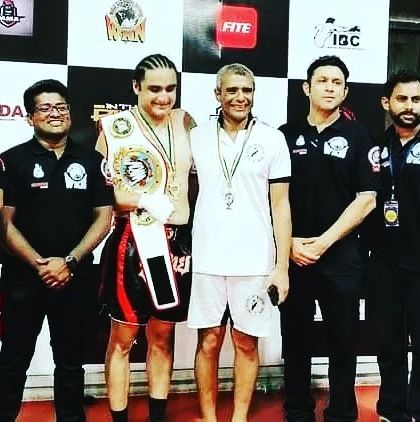 Our coaching staff and officials pictured with a champion fighter. We are deeply involved in the Indian martial arts community at every level.