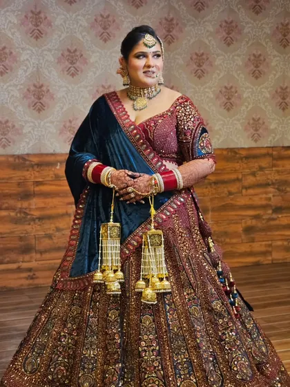 Another full-length view, showing the grand embroidery of the lehenga and how the makeup brings the whole look together.