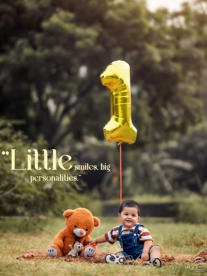 A simple and sweet outdoor first birthday portrait. The golden "1" balloon and the classic teddy bear are perfect props for celebrating this important milestone.