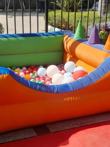 A clean and ready-to-use inflatable ball pool with soft, conical play shapes inside. I ensure all equipment is sanitized and in excellent condition.