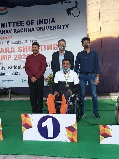 Sriharsha Devaraddi stands proudly on the number one podium after winning two gold medals at the 1st National Para Shooting Championship in Haryana.