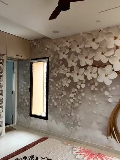 Here is a popular 3D floral tree wallpaper that I installed in a Goregaon bedroom. The design adds depth and a serene feeling to the room, making the wall behind the bed a stunning focal point.