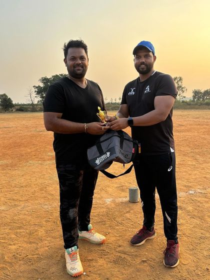 Presenting an award at the cricket league. It's great to recognize the effort and sportsmanship of our members.