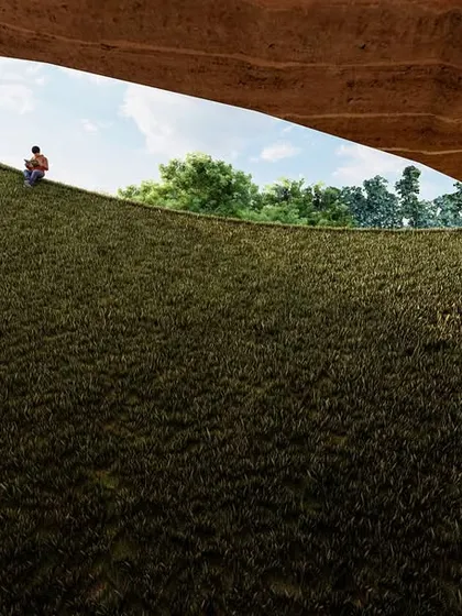 An oculus in the roof of the Elephant Pavilion allows the landscape to become part of the interior. This opening frames the sky and trees, reinforcing the connection to the outdoors while providing natural light deep within the structure.