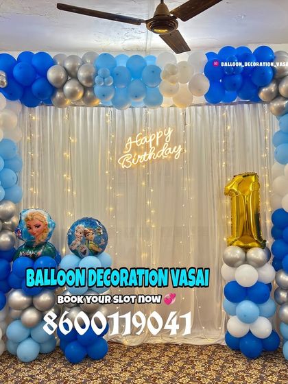A cool Frozen theme for a first birthday. This simple yet effective balloon arch in shades of blue, silver, and white is perfect for home celebrations, complete with character accents.