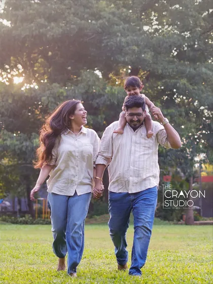 Let them run, laugh, and be wild. My favorite family portraits are the ones where you forget I am there, like this moment of pure happiness during a walk in the park, with a child enjoying the best seat on dad's shoulders.