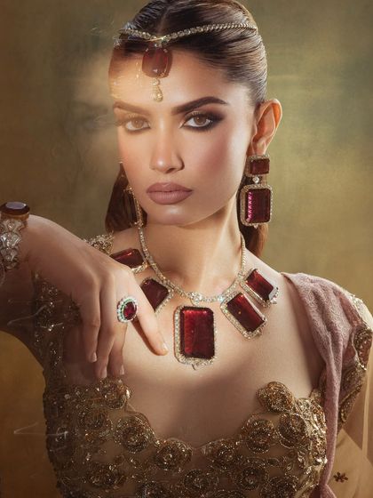 A powerful and artistic portrait. The makeup is bold, with a focus on the eyes and a perfectly sculpted face.