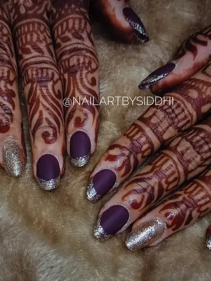 A bold and beautiful bridal look with matte purple nails and sparkling silver glitter tips. This is a great option for a reception or for a bride who loves color.