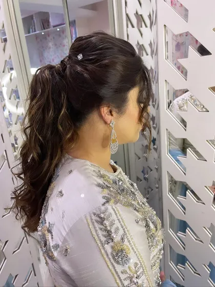 A side view of the textured ponytail, showing its volume and style.
