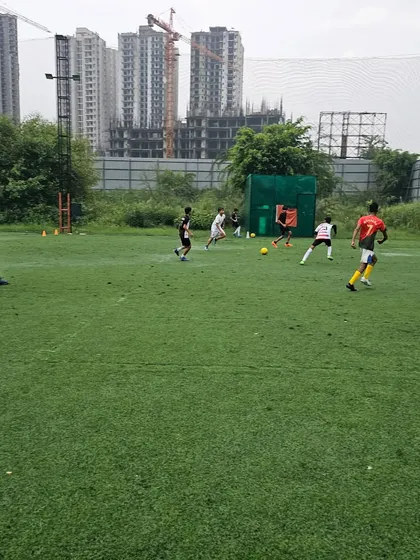 A wide view of a match in progress, showing player positioning and movement across the field.