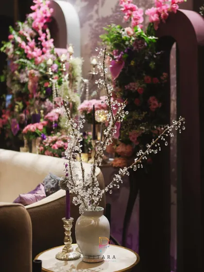 A touch of sparkle. We placed these delicate crystal branches in a simple white vase to catch the light and add a bit of magic to this cozy lounge corner.