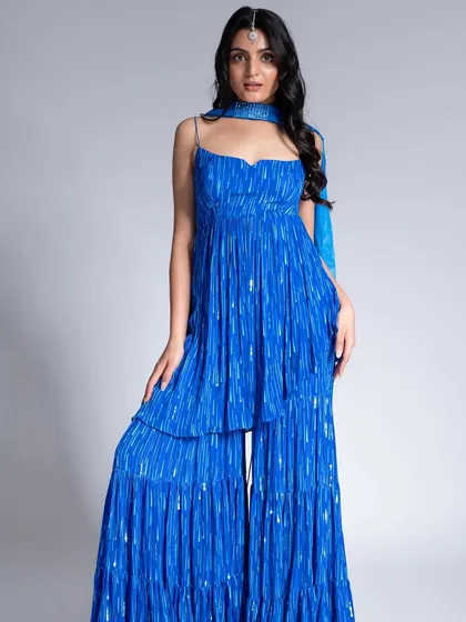 A vibrant look for Label Shivani Nirupam. I used a touch of silver on the eyes to complement the blue outfit and traditional maang tikka.