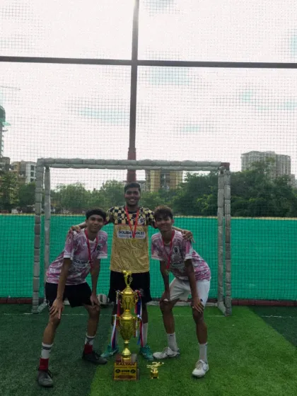 Three of our champion players standing tall with the trophy. Moments like these build confidence and a lifelong love for the sport.