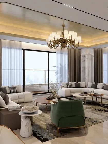 In this expansive boutique apartment in Nagpur, every corner tells a story of elegance and serenity. The living area features opulent grey and Dover white marble, with sophisticated veneer and plush green armchairs adding a touch of timeless charm and a pop of color.