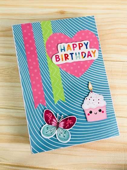 The cover of a handmade birthday scrapbook, decorated with cute stickers and a fun, vibrant design to celebrate a special day.