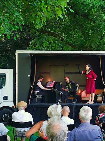 Our cabaret show on the road. This image shows us performing on a unique mobile stage built into a truck, allowing us to bring the theatre experience to diverse communities.