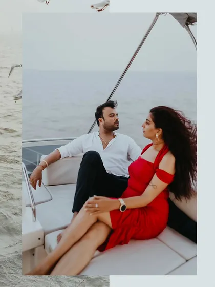 A stylish couple portrait from a luxury pre-wedding shoot on a yacht off the Mumbai coast. The wind and open sea provide a perfect, dynamic backdrop for your story.