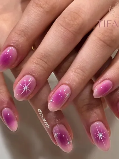 Shine bright with this stunning gradient pink and starry nail art, perfect for a touch of magic.