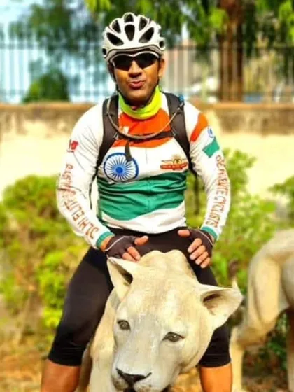 One of our captains posing on a lion statue during a ride. We never miss a chance for a fun and memorable photo op.
