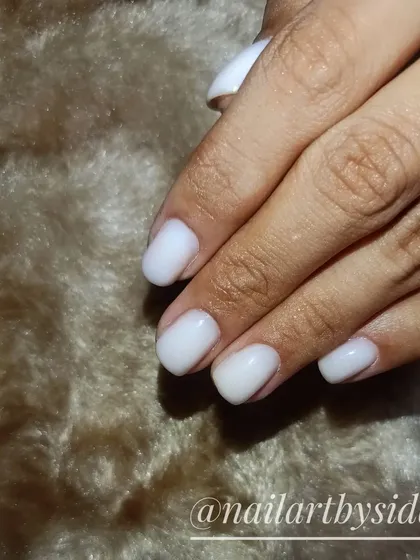A milky white overlay on natural nails, perfect for a chic and understated look.