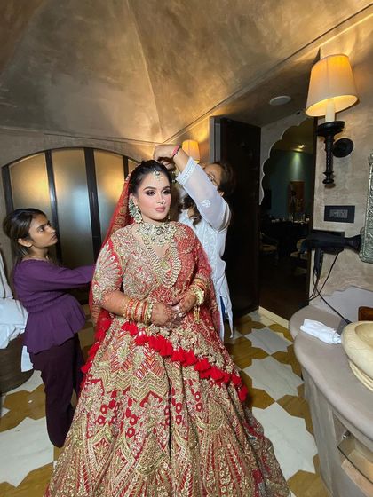 A wider shot of the bridal prep, showing the process of getting ready in a beautiful hotel suite. We can travel to your location for your convenience.