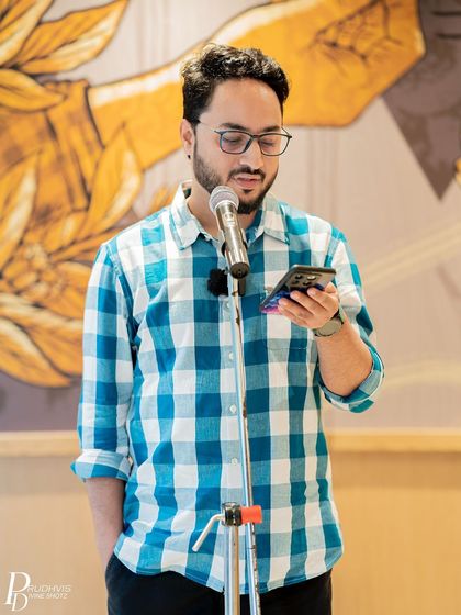 A poet in deep concentration as he shares his work. The theme inspired many powerful and reflective pieces.