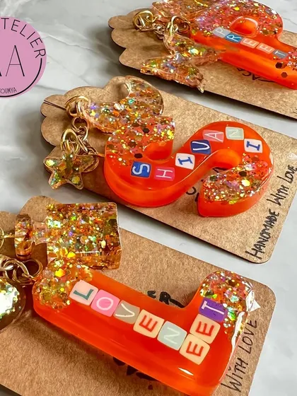 A collection of matching initial keychains I made for a client's friends. Each one is personalized with a name and initial, making it a thoughtful and fun gift.