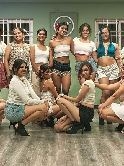 A group photo from one of our regular classes, showcasing our ever-growing community and the fun we have in the studio.