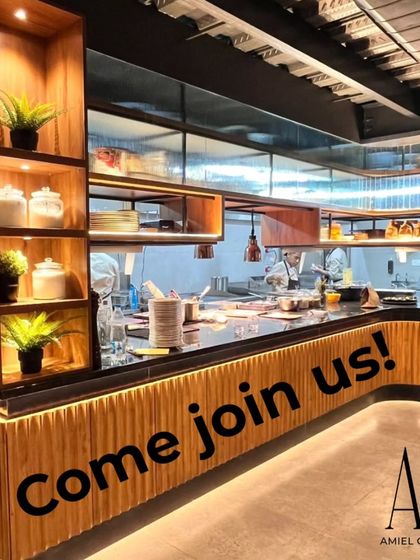 Come join us. A look inside my Yelahanka restaurant, with its warm lighting and modern wooden accents.