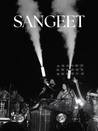 Let's make your Sangeet entry unforgettable. For this couple, I arranged a classic vintage car and equipped them with CO2 smoke jets for a high-energy, show-stopping arrival. It’s all about creating moments that match your personality and get the party started right.