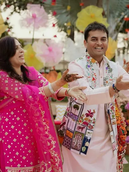 Family members dancing and enjoying the festive atmosphere of the garden Mehendi.