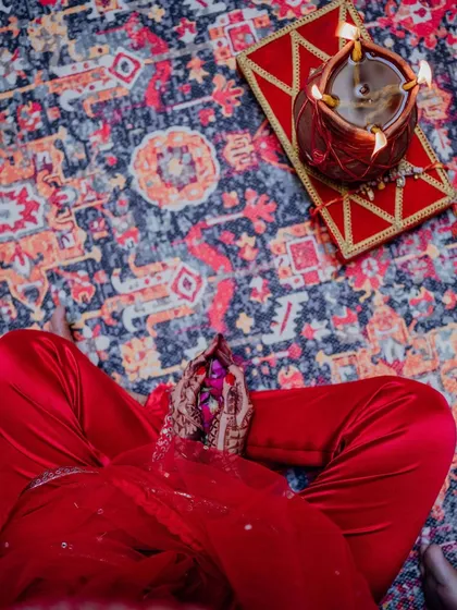 The chooda ceremony, a significant pre-wedding ritual for the bride. The setup is kept traditional and intimate, focusing on the blessings from family.