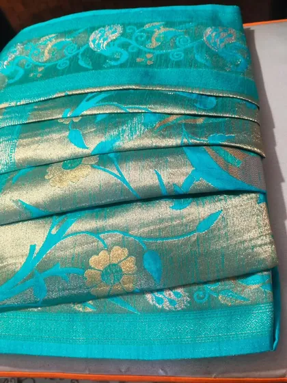 We are always excited to work with different draping styles. This is a Gujarati style saree that we pre-pleated and box-folded for the first time, making it travel-friendly and easy for our client to wear.