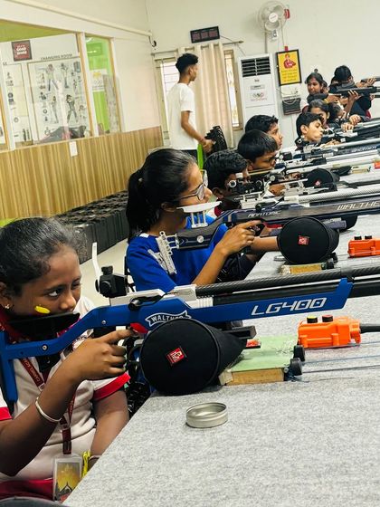 Students from Carmel Academy using professional-grade Walther LG400 air rifles during their training session.