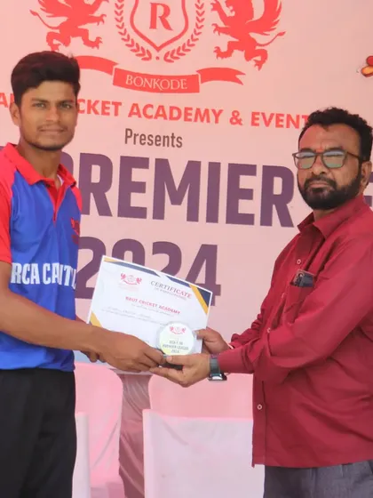 A member of the RCA Capitals team being awarded his certificate at the presentation ceremony.