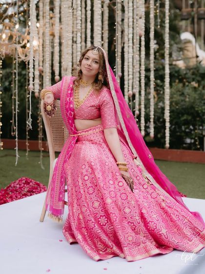 This look is all about makeup that feels like skin. For this bride in a vibrant pink lehenga, I created a soft, natural look that let her own beauty take the lead.