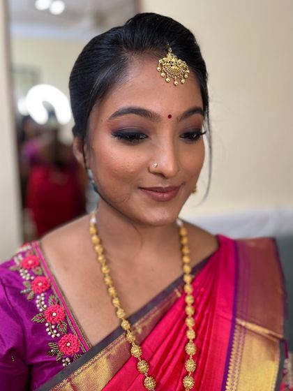 Niveditha's Viratham look. We went for a subtle smokey eye and nude lips, a classic and elegant choice for a pre-wedding ceremony.