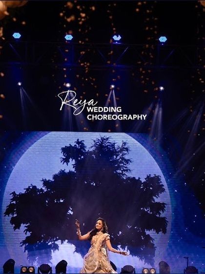 Bridal solos are my favorite! This shot, with the bride framed by a moon visual and golden balloons, is a perfect capture of a magical performance.