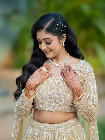 A close-up of the bride admiring her ring. The soft makeup allows her happiness to be the focus.