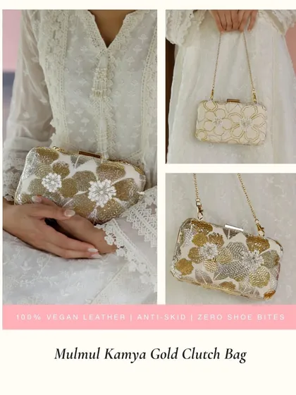 The Mulmul Kamya Gold Clutch Bag features beautiful 3D floral details made from sequins and beads. It comes with a delicate chain strap, offering versatility to be used as a clutch or a shoulder bag.